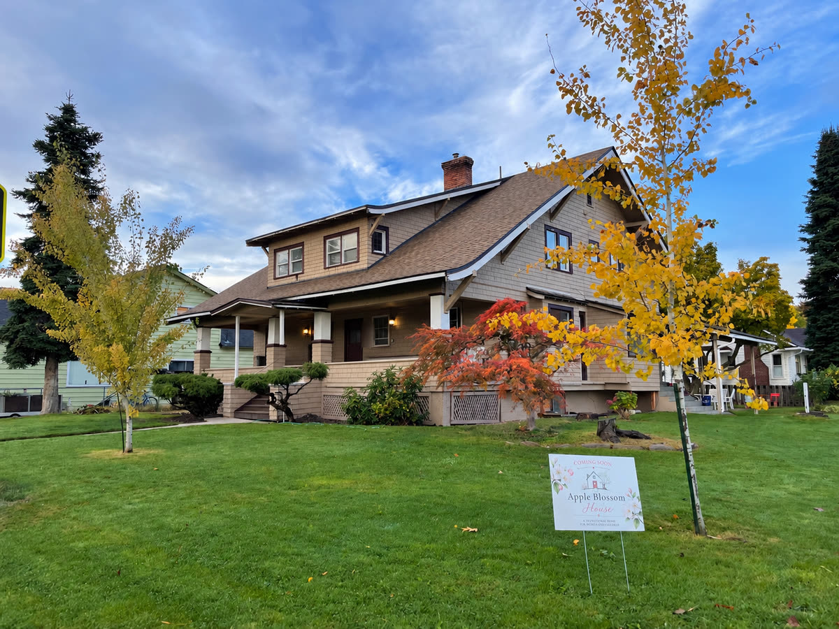 Apple Blossom House in autumn, with its Coming Soon sign in the front yard