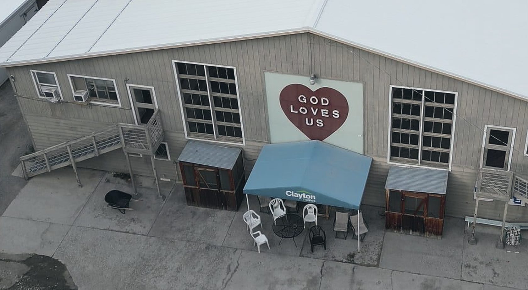 A hand-painted heart on the wall of the shelter reading God Loves Us
